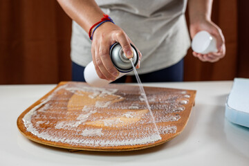 spraying glue for chair seat foam upholstery detail