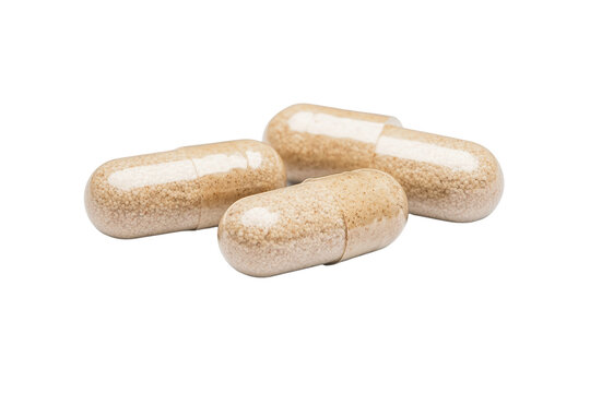 Three dietary supplement capsules on a white isolated background.