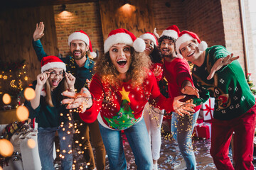 Photo of nice young people dancing have fun cheerful excited enjoy cozy christmas decoration...