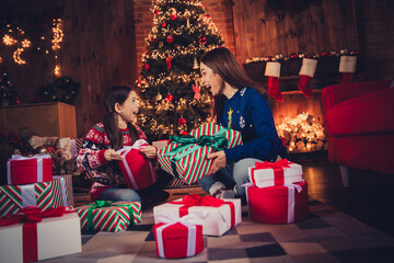 Full body portrait of two people mother daughter hold desirable giftbox festive christmas time flat indoors