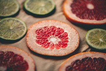 Sliced orange, tangerine and grapefruit slices on baking sheet, preparing citrus wedges for Christmas garland