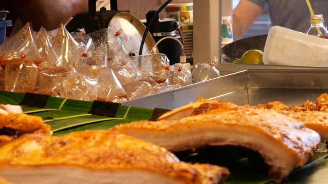 Street food at Chatuchak Weekend Market, Bangkok. It is also known as JJ Market. This is a must-visit place for tourists. It is one of largest outdoor markets in the world.
