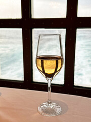 Glass of wine on a table in the restaurant of a cruise ship. Holiday concept.