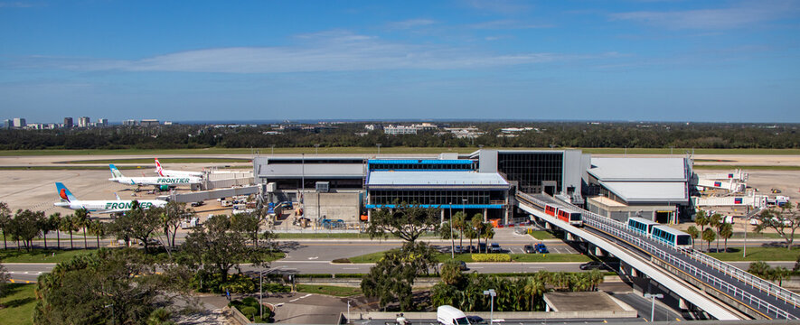  Wide shot of commercial aircraft and terminal building at Tampa International Airport - Tampa, Florida, USA