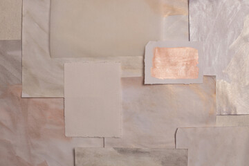Beige neutral paper torn frame card on painting wall. Abstract collage texture copy space...