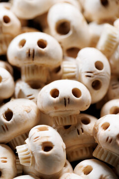 Naklejki Mushroom skulls, focus on the middle, close up view. Halloween food concept