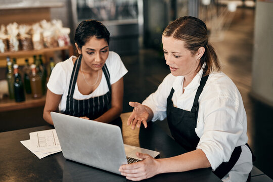 Restaurant, waitress or business owner on laptop for planning budget, online review or admin. Franchise, manager and barista with teamwork in startup shop for report, stocktake or social media blog