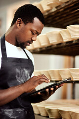 Chef, tablet and baker in factory for manufacturing, inventory storage or track order online. Bakery, black man and technology for food production, check stock or quality inspection in small business