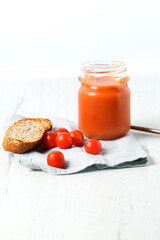 Fresh gazpacho with slices of toasted whole wheat bread