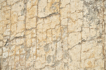 Natural stone fractured texture in light beige with gray. Copy space