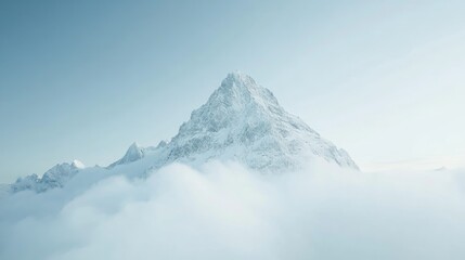 Majestic Snow-Capped Peak Emerging from Clouds