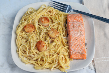 baked seasoned  salmon  with  spaghetti and scallops,