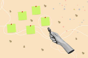 Woman hand holding the handle of a magnifying glass on a beige background with green adhesive notes