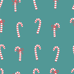 Candy cane with red bow seamless pattern. Christmas sweets backdrop. Festive ornament with candies on teal background.