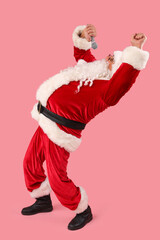 Cool Santa Claus with microphone singing on pink background