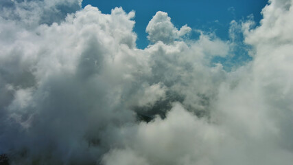 Flying through white fluffy clouds