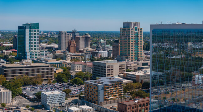 Aerial view of Sacramento, California, highlighting modern skyscrapers like Wells Fargo Center and the iconic California State Capitol dome.