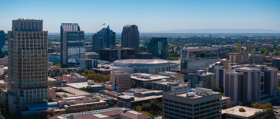Aerial view of Sacramento, California, highlighting the Wells Fargo Center, US Bank Tower, Golden 1 Center, and the distant Sacramento River.
