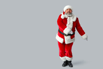 Dancing Santa Claus on grey background
