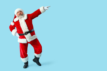 Dancing Santa Claus on blue background