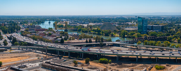 Aerial view of Sacramento, California, featuring the yellow gold Tower Bridge, the Ziggurat...