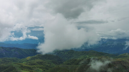 Clouds over summer green mountains