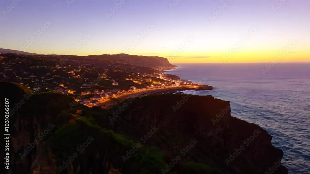 Poster sunset over rugged cliffs with a view of the ocean.