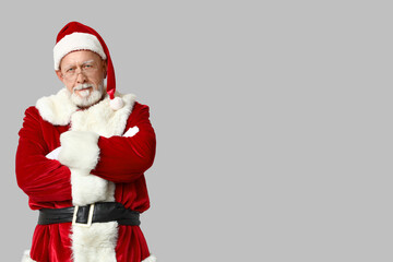 Cool Santa Claus in glasses on grey background