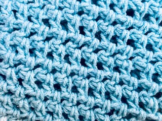 blue wool thread crochet texture . background close up