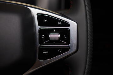 Naklejka premium The modern cars steering wheel control panel boosts convenience and performance