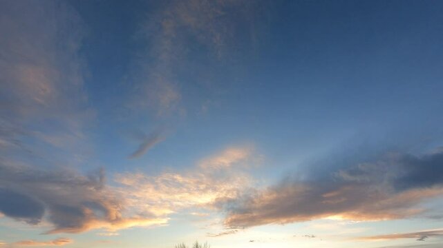 time-lapse sunset sky, cloudscape background. colorful clouds generate powerful energy and environment. wide-angle sky in the sunrise reflect on cloudscape. peaceful nature background