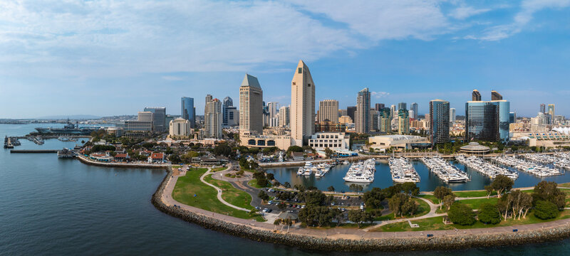 Aerial view of San Diego's skyline featuring high rise buildings, the Marriott Marquis, Manchester Grand Hyatt, a marina, and San Diego Bay.