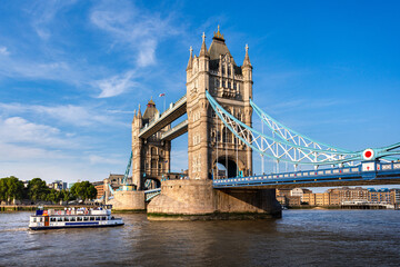 Tower Bridge over Thames river famous tourist landmark with cruise in river transportation for...