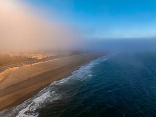 Aerial View of Ocean Beach and Fog Covered San Francisco Cityscape