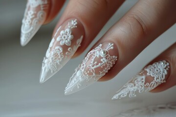 Elegant white lace nail art showcasing intricate designs with a delicate floral pattern, perfect for a bridal look or special occasion