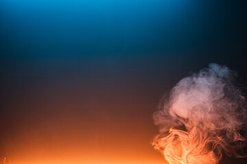 Twisted plume of smoke. The movement of smoke on a colored background. Abstract smoke lines