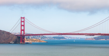 Golden Gate Bridge with Sailboats and Partly Cloudy Sky