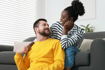 International relationships. Portrait of lovely couple at home