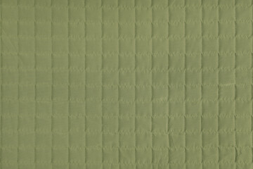 Fototapeta premium Checkered stitching pattern, khaki quilted fabric background. Blanket stitch square texture