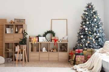 Interior of light living room with Christmas tree, shelf units and presents
