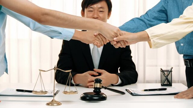 Corporate attorney applaud as business people make a successful deal or agreement with handshake, celebrating mutually beneficial acquisition. Business handshaking concept. Slow motion. Rigid.