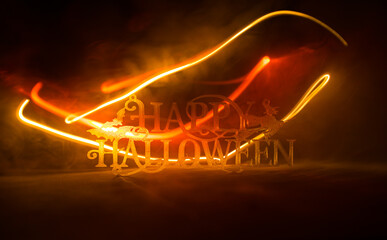 Halloween concept. Creepy silhouette in the dark corridor with pumpkin head. Toned light with fog...