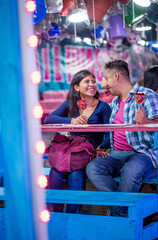 Front shot, subjective view of a couple playing the lottery with great enthusiasm. Vertical format for social media posts.