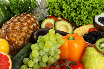 Different fresh vegetables and fruits as background, closeup