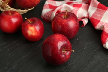 Fresh ripe red apples on grey textured table