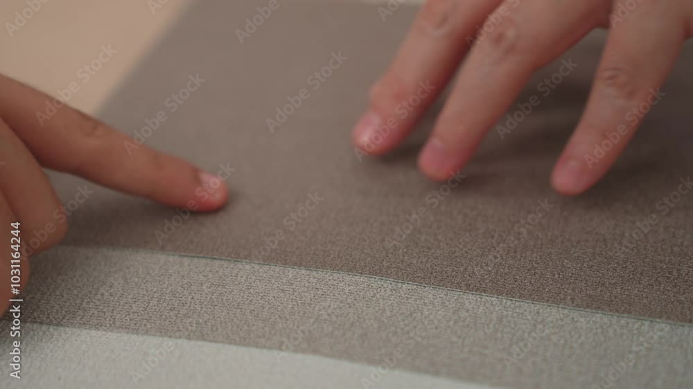 Poster slow motion hand closeup of professional architect and interior designer presenting material and col