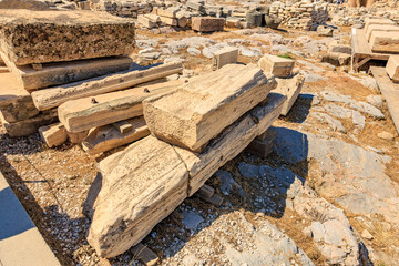 A pile of stone blocks with a shadow on the ground, Acropolis in Athens