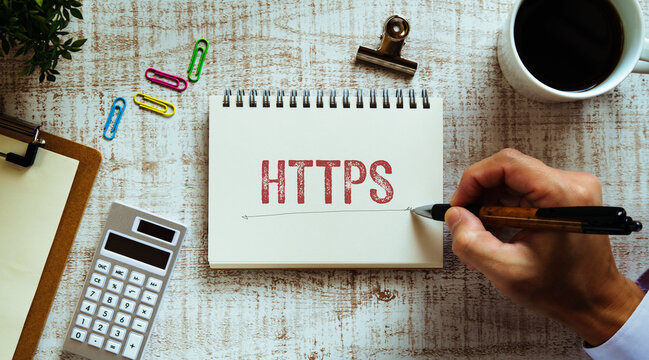 There is notebook with the word HTTPS. It is an abbreviation for Hypertext Transfer Protocol Secure as eye-catching image.