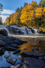 Buttermilk Falls Long Lake NY ADK with brilliant fall foliage and reflections 