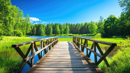 Obraz premium Scenic Wooden Bridge Over Tranquil Lake View